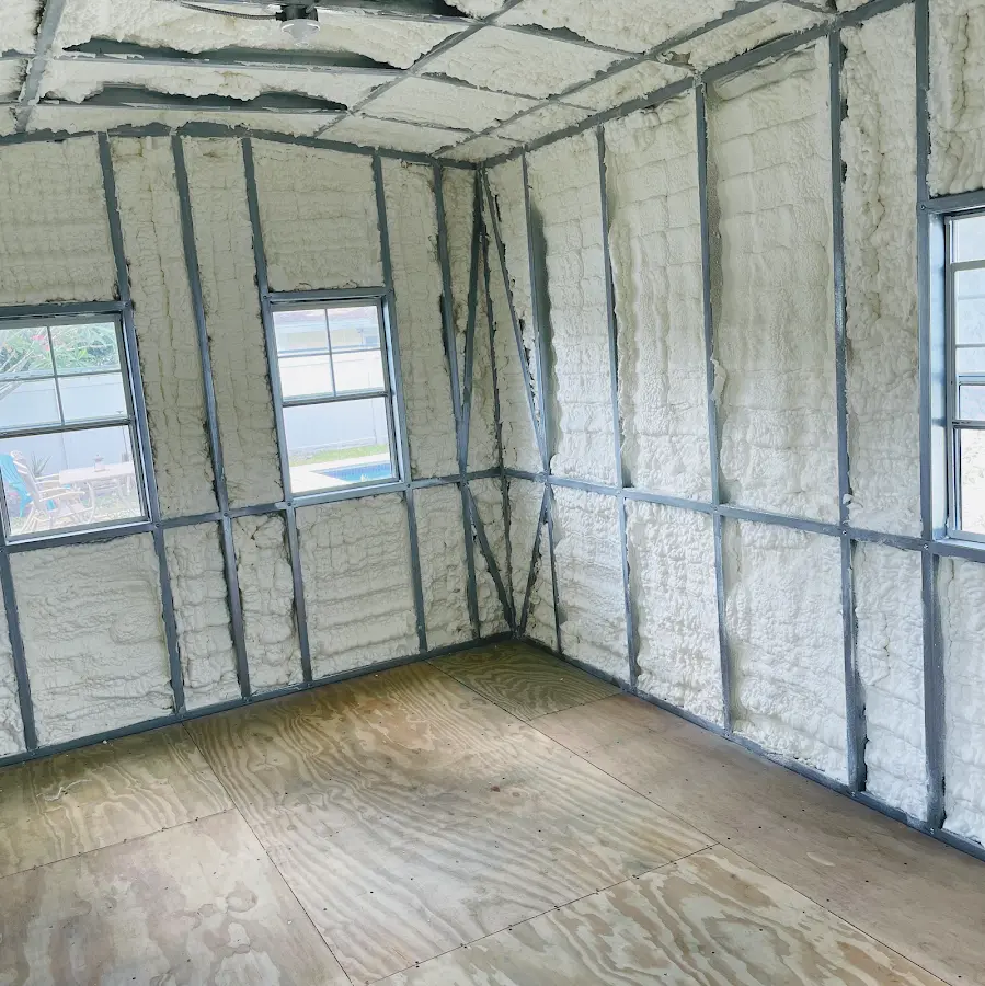 Closed-cell spray foam insulation applied to wall cavities in a residential project in Mashpee